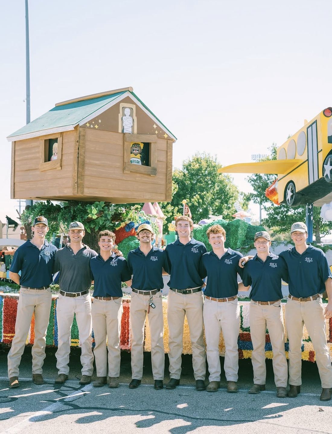 Phi Kappa Chi brothers with the float