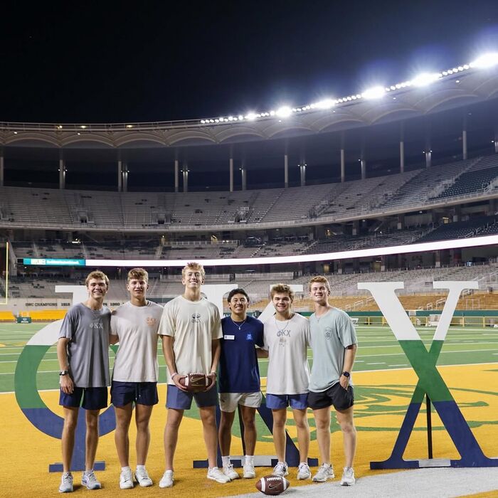 Phi Kappa Chi brothers at McLane Stadium during rush
